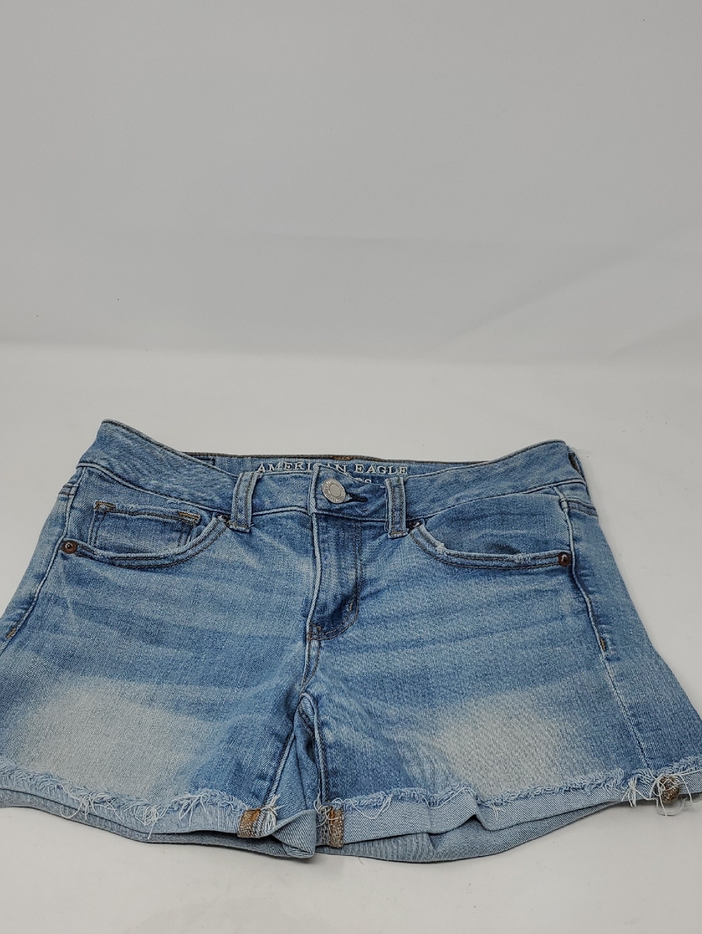 American Eagle Outfitters MIDI. Light Blue Distressed Denim Shorts